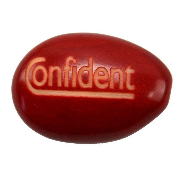 a tagua nut with the word 'confident'