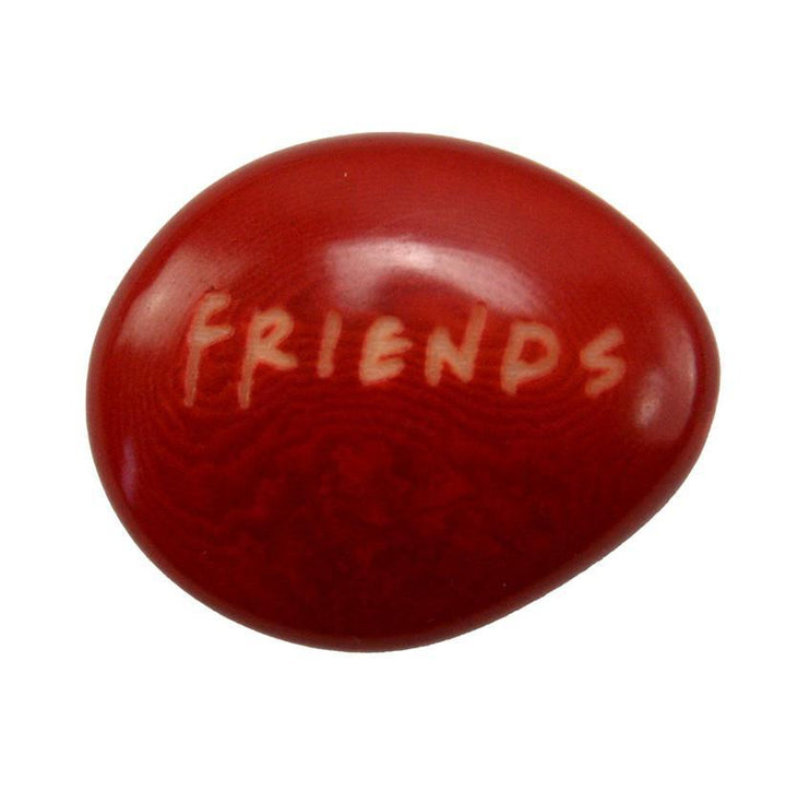 a red tagua nut with the word 'friends'