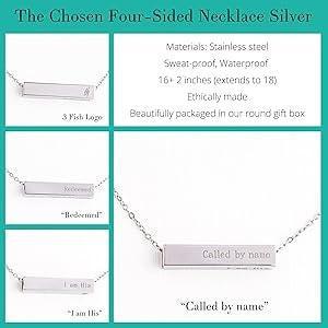 Silver necklace with engraved message on a teal background