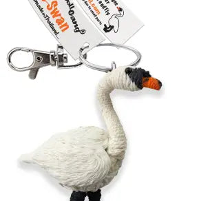 A white swan-shaped keychain charm with a silver metal clasp and key ring, featuring a black-and-orange beak and small black legs. A branded paper tag is attached, and the background is plain white.