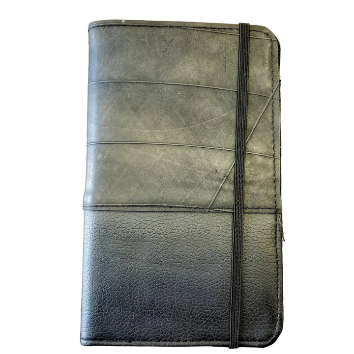 Black tire passport holder on a white background