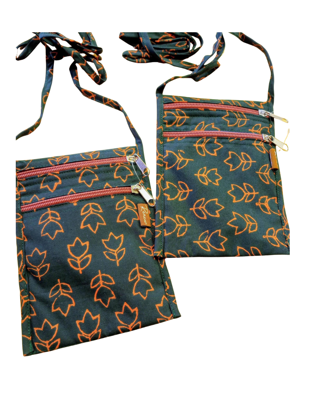 Two tulip patterned passport sized bags with zippers on a white background