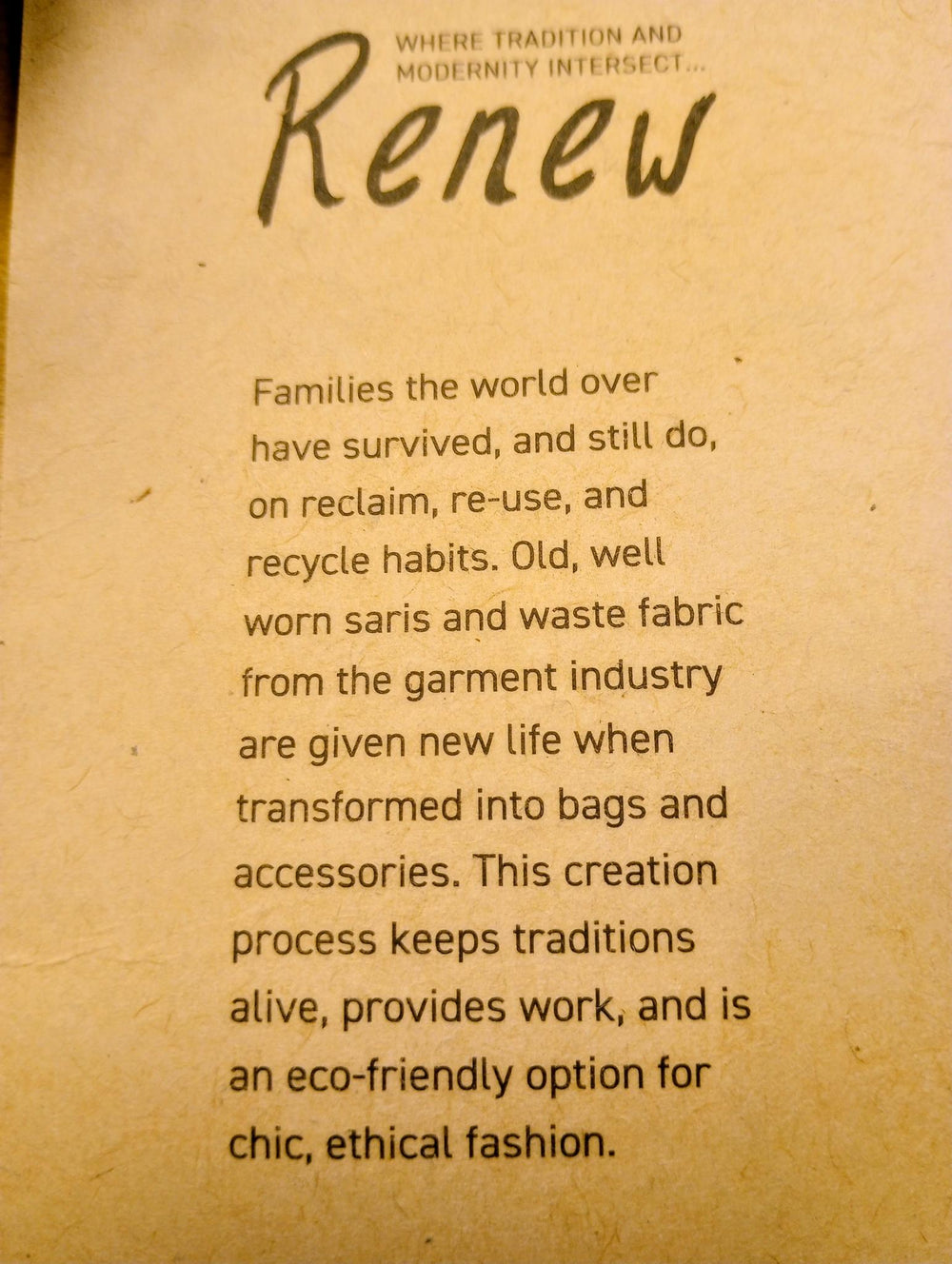Text on a brown background about reclaiming and recycling fabric into bags and accessories.