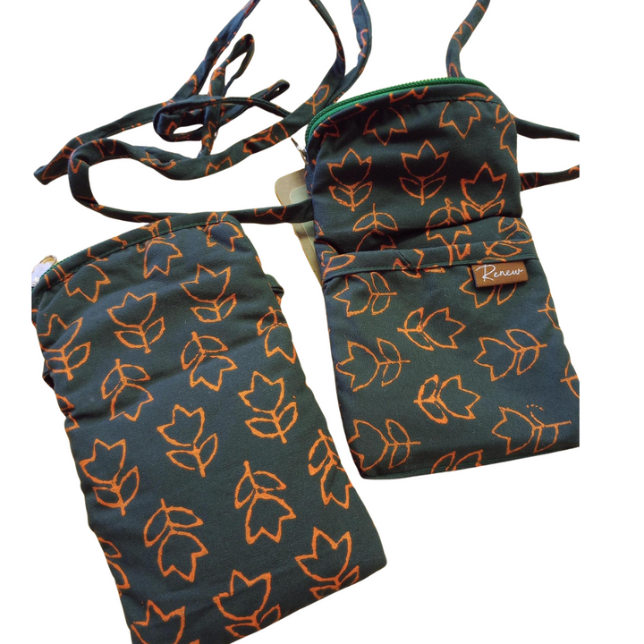 Two fabric phone sized bags with tulip pattern and lanyard on a white background