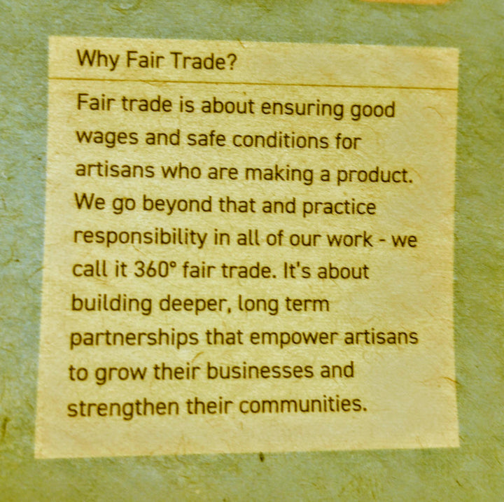 Text explaining fair trade practices on a textured background