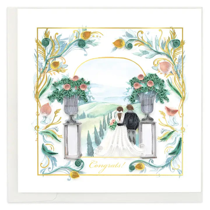 Wedding card with a couple under an arch, flanked by floral urns, surrounded by decorative elements.