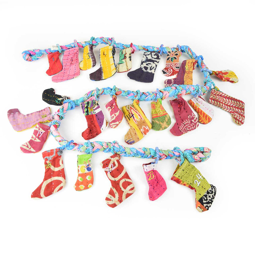 Upcycled sari advent garland on a white background