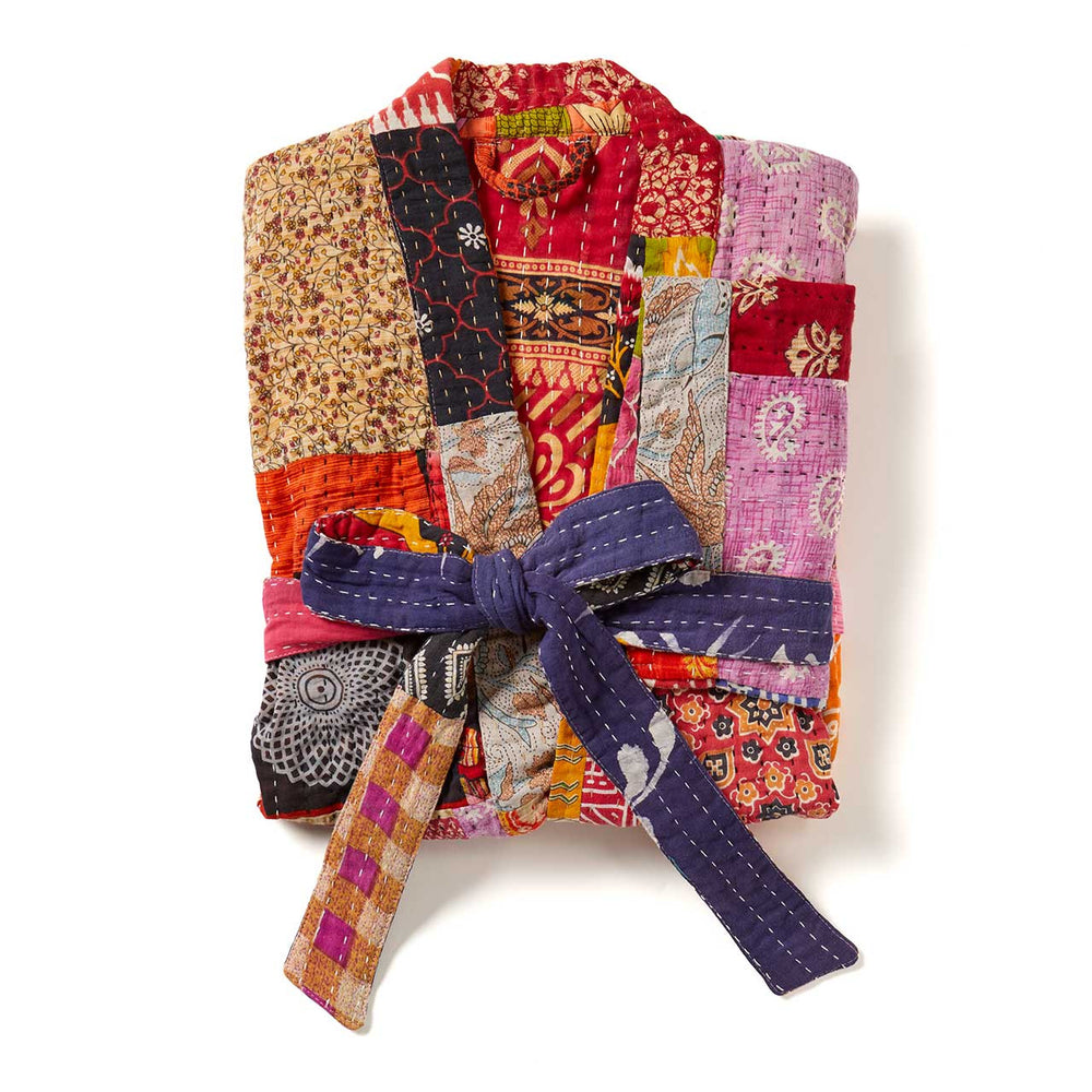 Colorful sari robe with a purple tie on a white background
