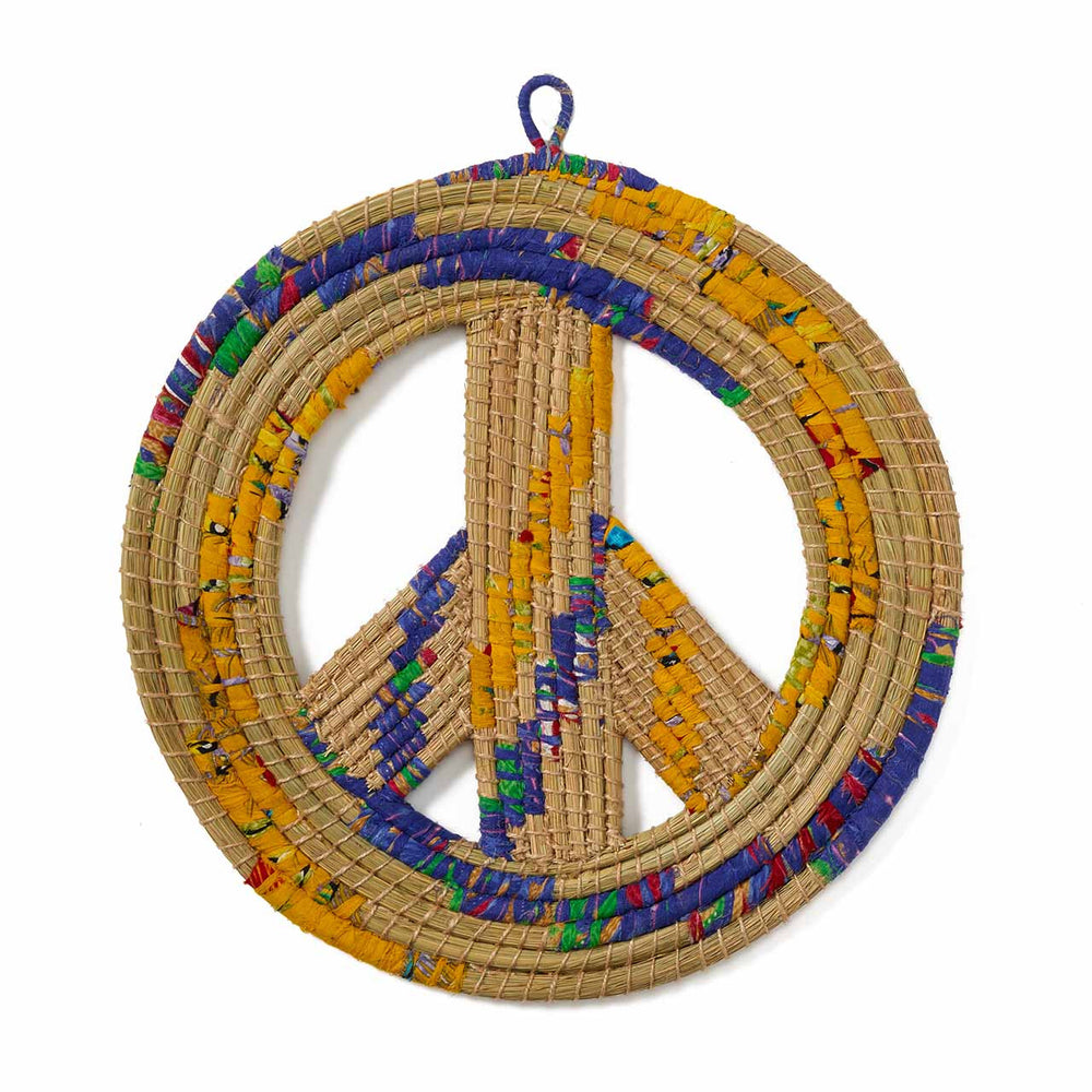 Woven peace symbol with colorful accents on a white background