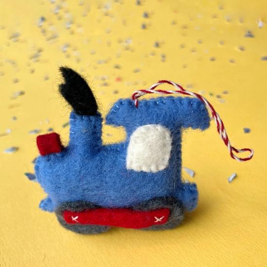 Handmade felt ornament in vehicle shape of blue train.