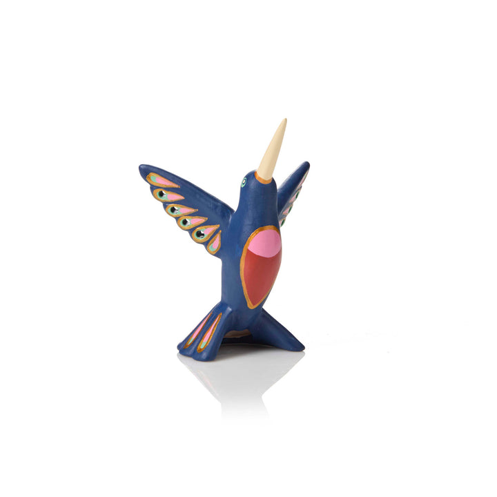 Colorful ceramic hummingbird sculpture on a white background