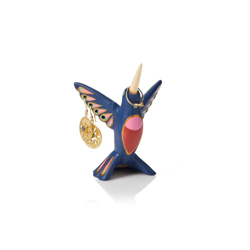 Colorful hummingbird-shaped jewelry holder with a gold charm on a white background