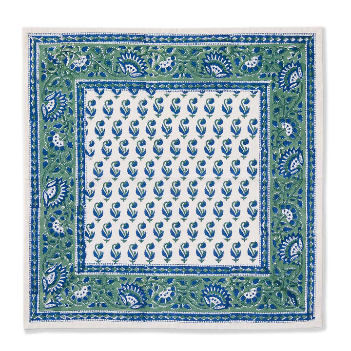 Square fabric with blue and green floral pattern on a white background