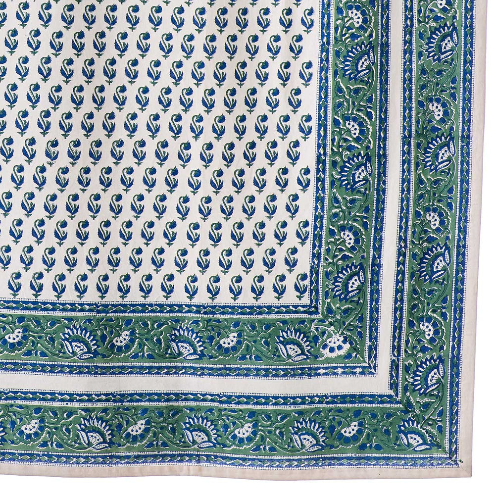 Close-up of a blue and green patterned fabric with a border