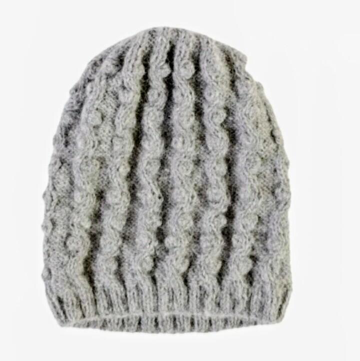 Gray knitted beanie on a white background