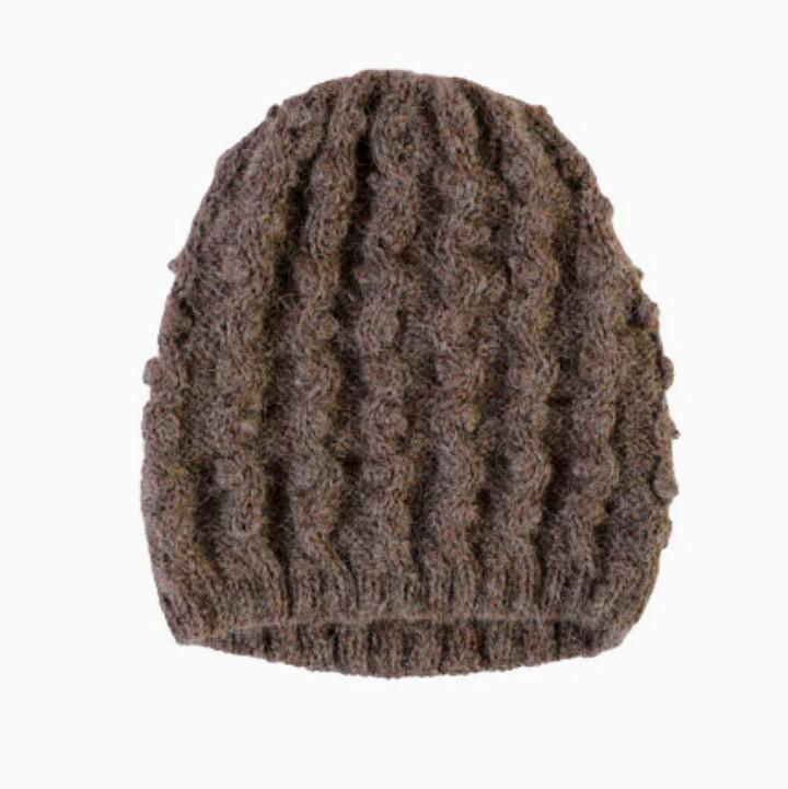 Brown knitted beanie on a white background