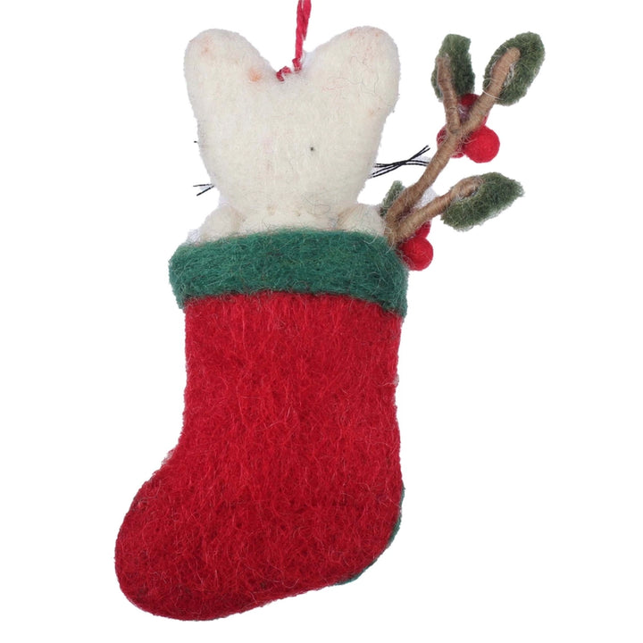 Felted Christmas ornament of a mouse in a red stocking with green trim, on a white background.