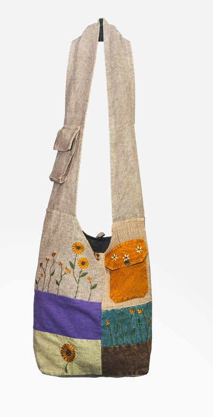 A patchwork crossbody shoulder bag with sunflowers.