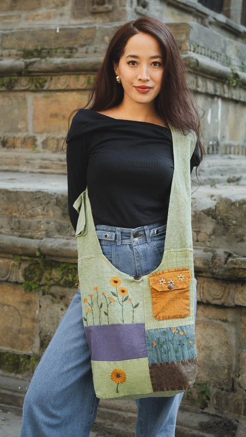 a women wearing a patchwork bag. 