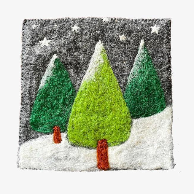 Textile art piece with green trees and a red house on a gray background