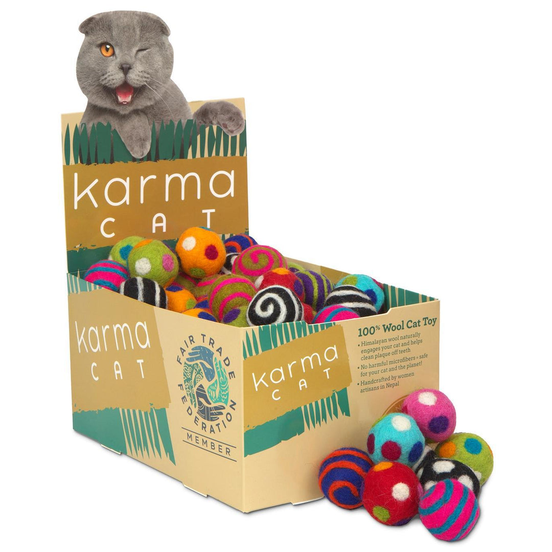 Box of Karma Cat toys with colorful catnip balls and a cat figure on top.