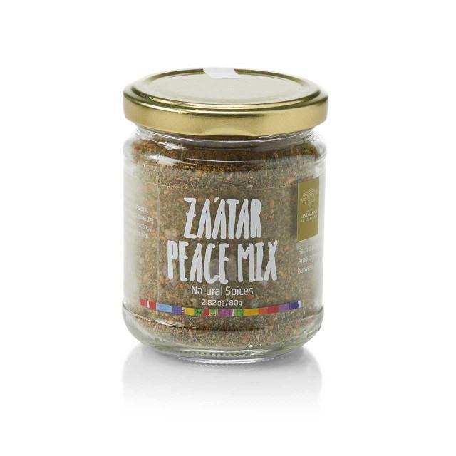 A glass jar containing Za'atar spice mix with a label that reads 'Za'atar Peace Mix. Natural Spices.