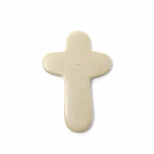 A small soapstone cross with natural beige and brown colors, carved from a single piece of Kisii soapstone.