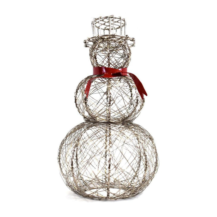 A wire snowman with a red scarf standing against a white background.