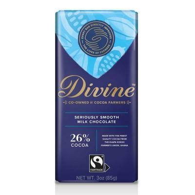 A bar of Divine milk chocolate with 26% cocoa, packaging predominantly blue and white with company branding and product information.