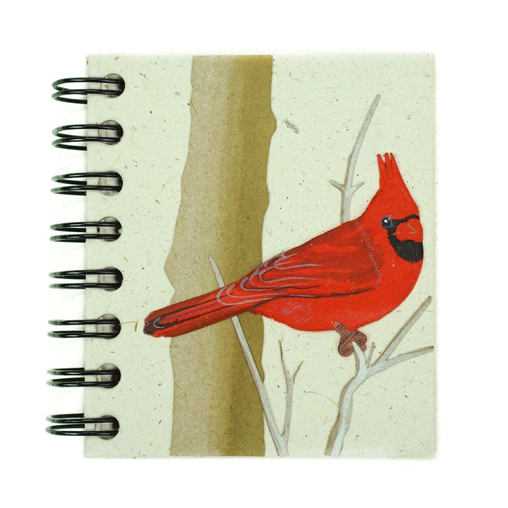 small spiral notebook with a cardinal