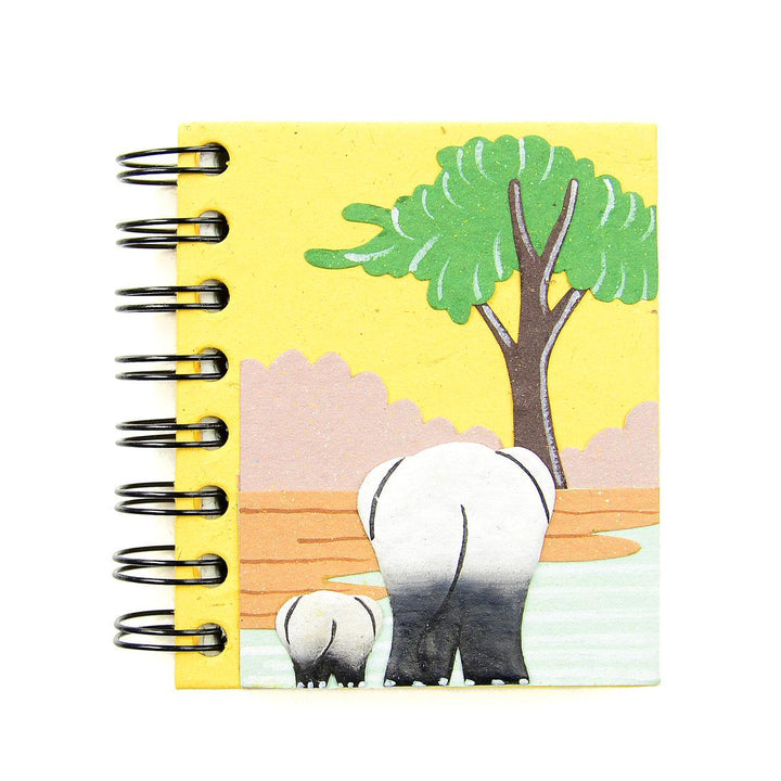a small spiral notebook with a pair of elephant rear ends. 
