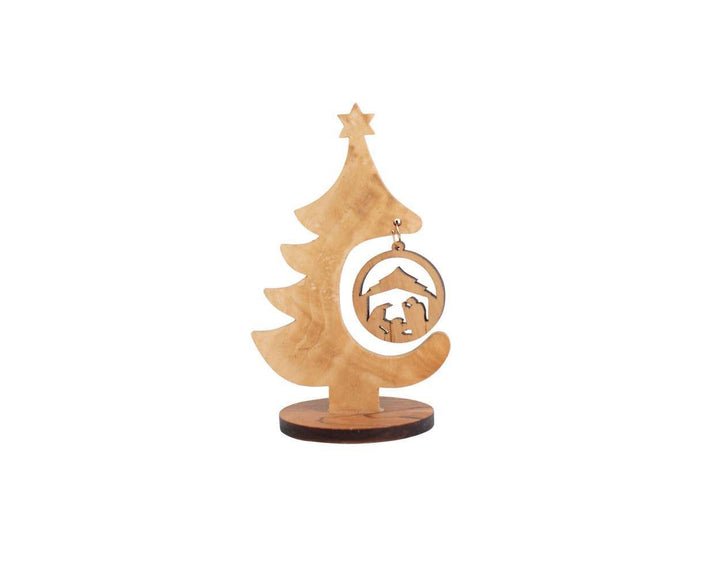 Christmas tree nativity made from olive wood on a white background