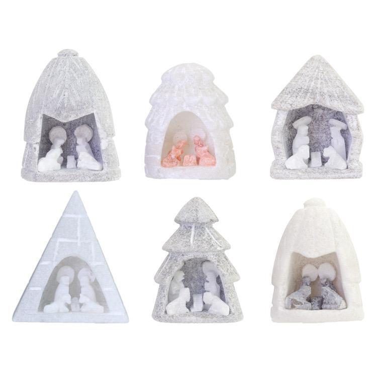 Hand carved mini nativities carved from alabaster, each with a different shape or shade of alabaster. 