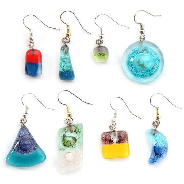 A collection of colorful art glass earrings in various shapes displayed on a white background.