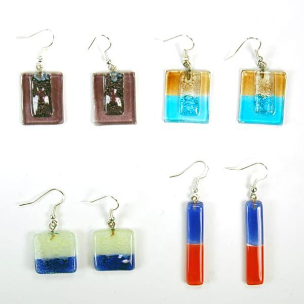 A collection of colorful art glass earrings in various shapes displayed on a white background.