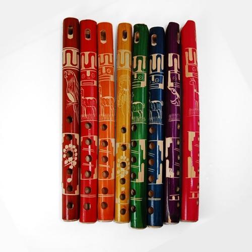 Colorful bamboo flutes with creative patterns on a white background