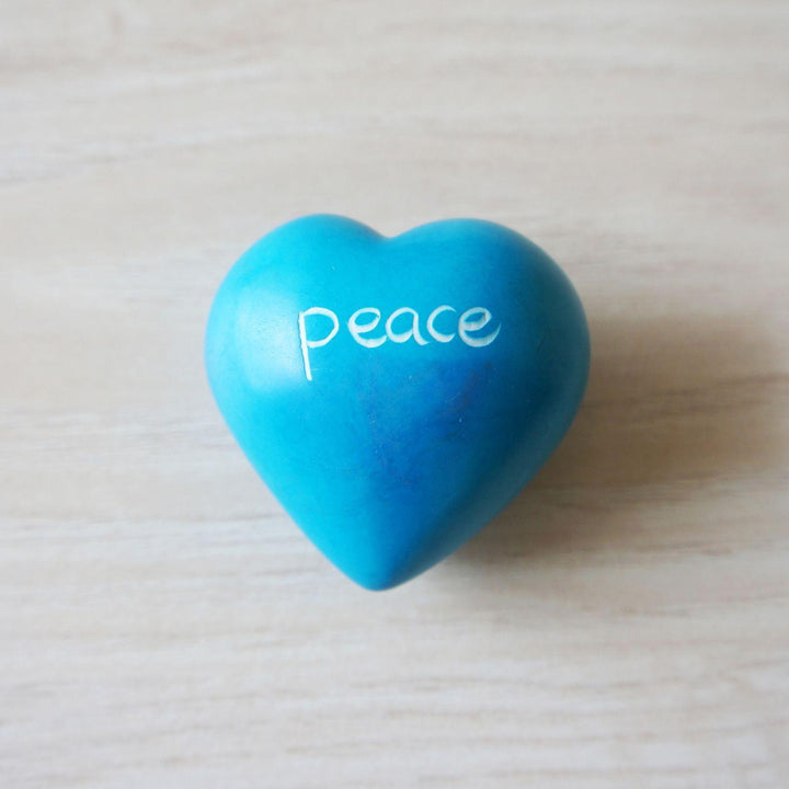 A blue kisii peace heart on a wooden background
