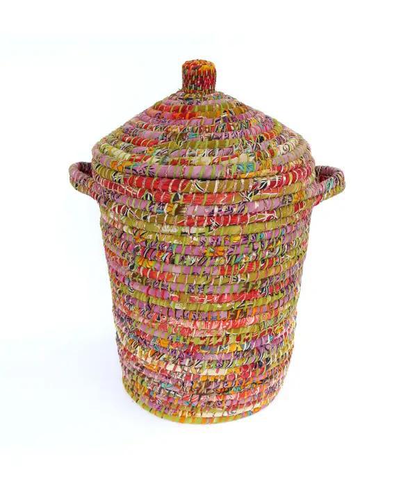Bright sari hamper on a white background
