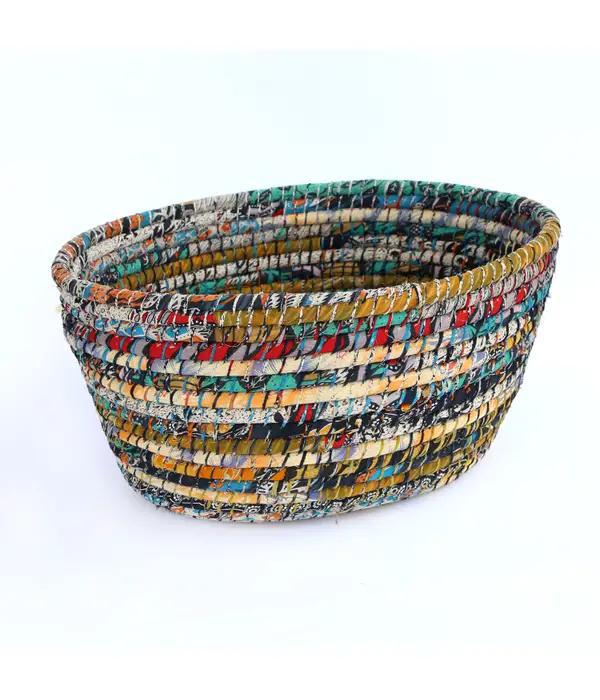Bright sari laundry basket on a white background