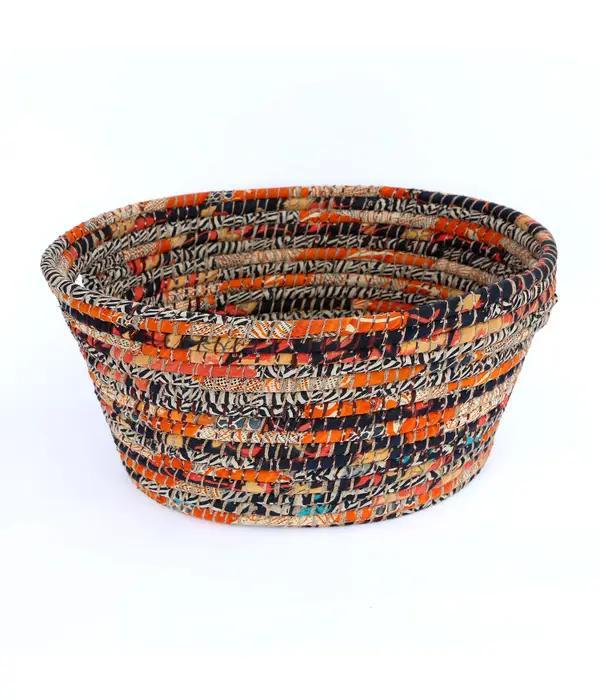 Bright sari laundry basket on a white background