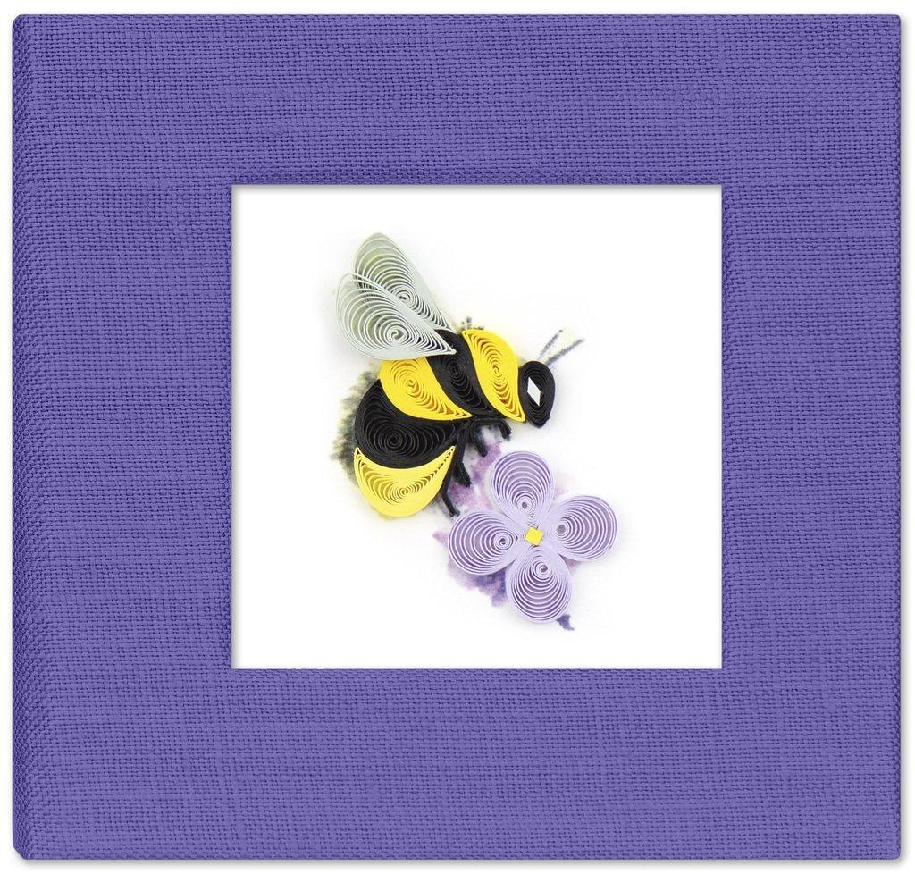 A handcrafted red sticky note cover with a quilled bumble bee design on the front, made of paper, displayed against a white background.