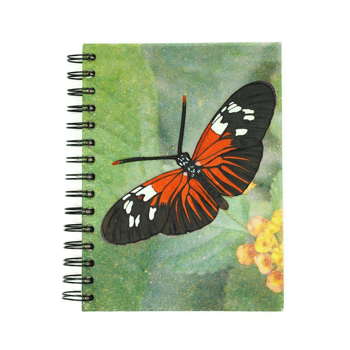 orange butterfly on a Mr. Ellie Pooh Notebook