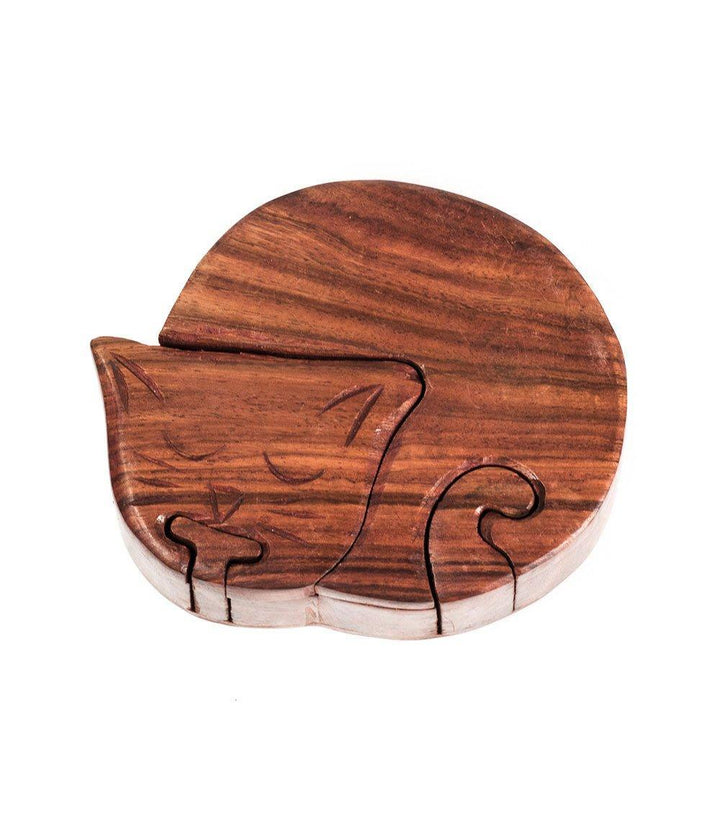 A hand-carved wooden puzzle box in the shape of a cat, with a dark brown finish.