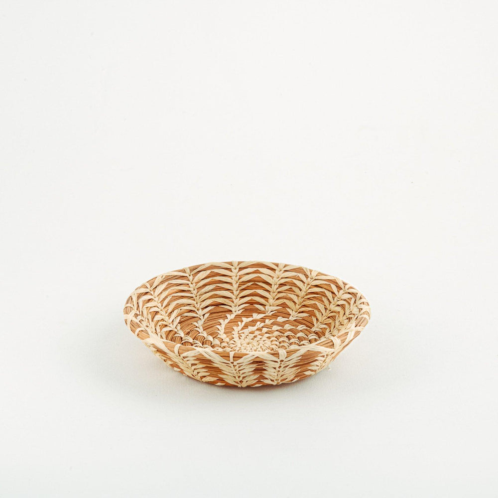 Handmade woven basket with spiral and striped pattern