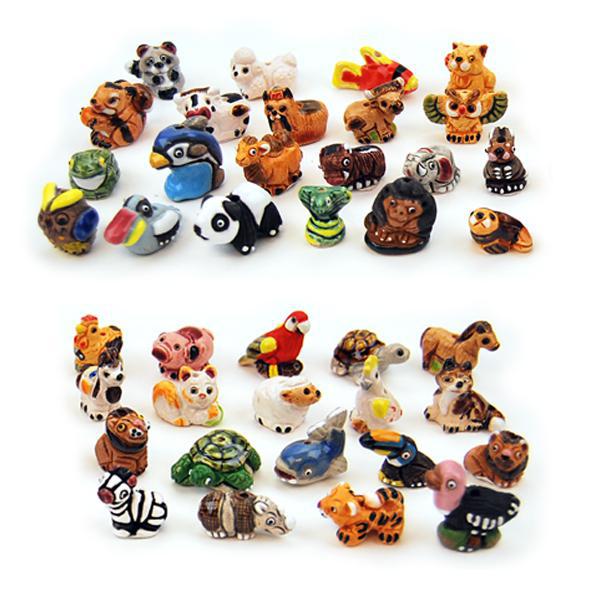 A collection of various ceramic animal figurines, intended as decorative items possibly for fairy gardens.