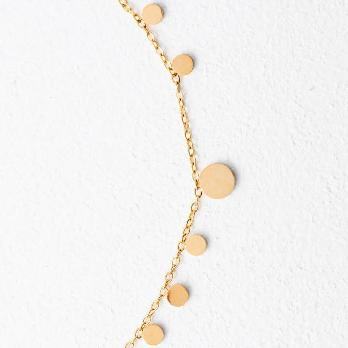 A gold-plated stainless steel necklace with a series of circles linked together in a chain, displayed against a white background.