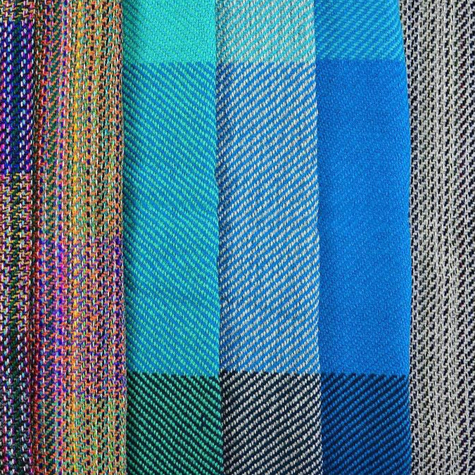 Variety of shawls with colorful patterns.