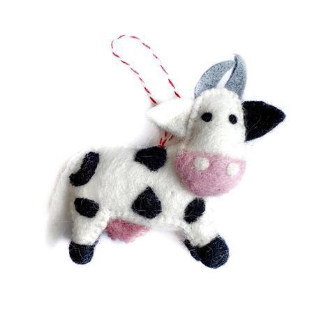 Handcrafted wool ornament in the shape of a black and white cow.