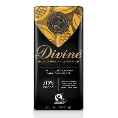 A bar of Divine dark chocolate with 70% cocoa, packaging predominantly black with yellow cocoa pod design and text detailing the product as vegan and fair-trade.