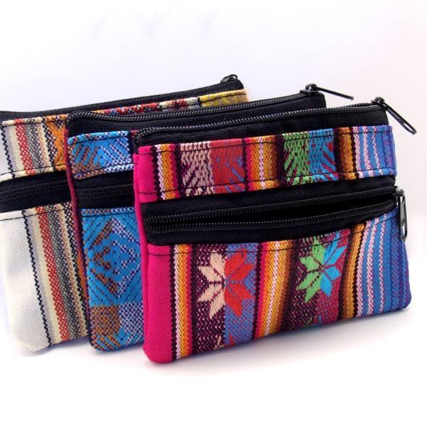 A collection of three coin purses with double zippers, featuring colorful woven designs.